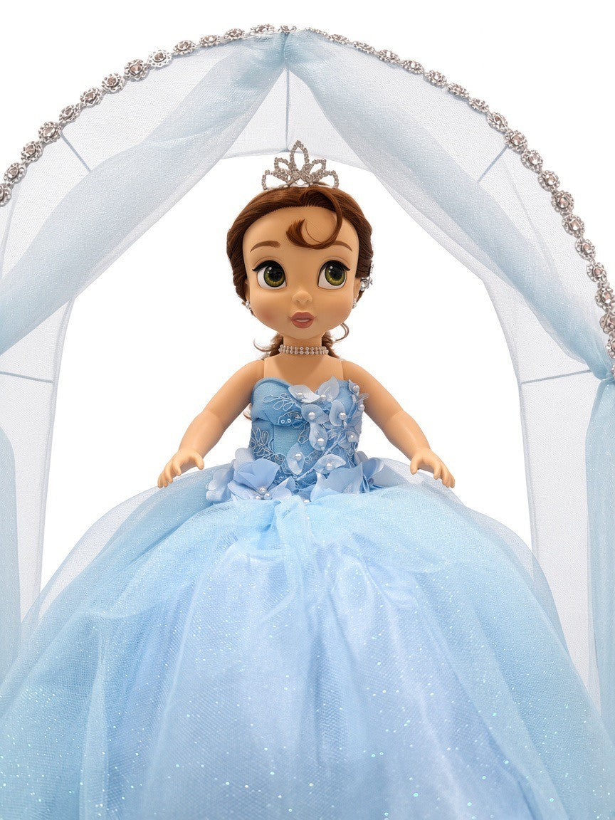Close-up of blue última muñeca showing tiara, pearl choker and floral pearl bodice