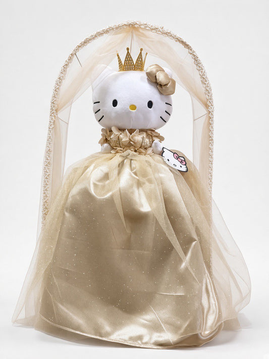 Gold HK última muñeca front view – gold crown, satin bow and glitter tulle gown under a champagne tulle arch